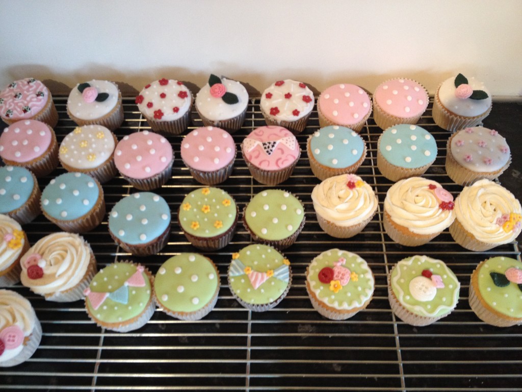 Cath Kidston themed cupcakes with bunting and flowers.